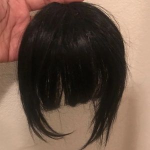 Black clip in bangs